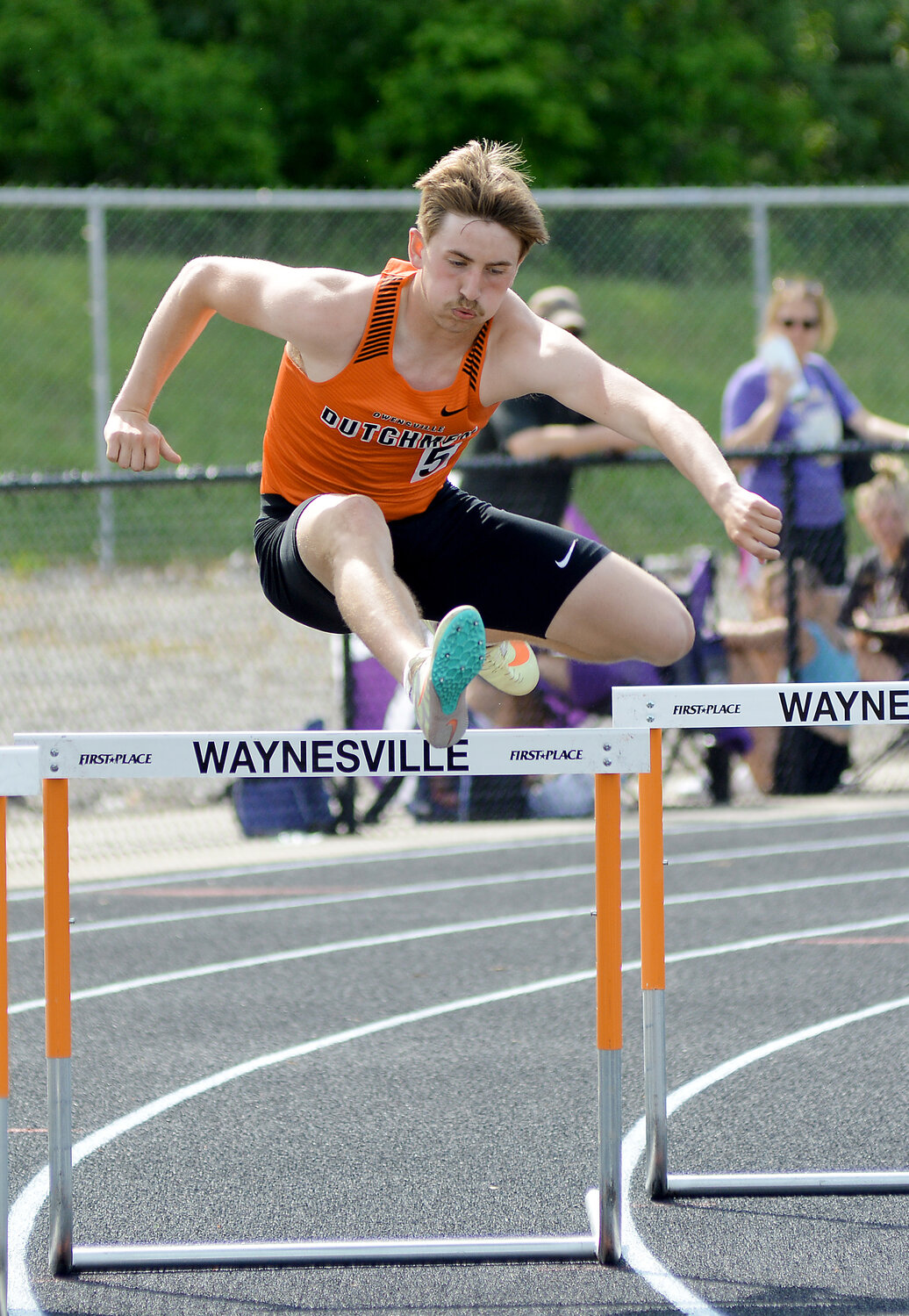 Bryce Payne clears a hurdle during the boys 300m hurdles. Payne won a district title in the 110m hurdles before placing second in the 300m hurdles.